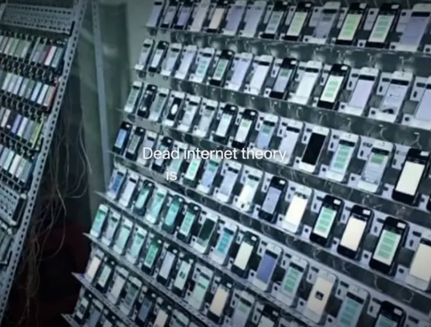 Frame from the reel, racks of phones with the caption Dead internet theory is getting real