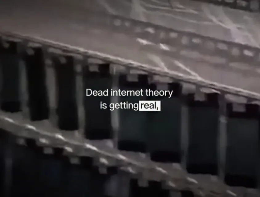 Frame from the reel, racks of phones with the caption Dead internet theory is getting real